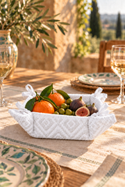 CESTINO pure white textured basket with figs, oranges and olives