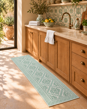 TAPETO Verde 23 × 64 inch woven runner in a Mediterranean kitchen with green ceramics and white PANE towels
